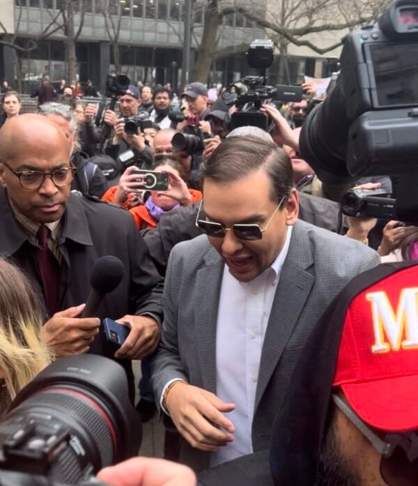 congressman George Santos in custody charged with fraud, money laundering and theft