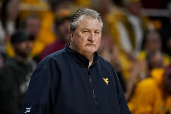 West Virginia basketball coach Bob Huggins resigns after a drunken driving arrest