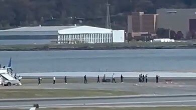 United Airlines Evacuation Footage Shows Passengers Leaving Plane at Reagan National
