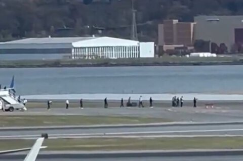 United Airlines evacuation footage showing passengers leaving plane at Reagan National Airport