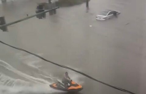 Video: Man rides jet ski through flooded streets after severe storms in Norfolk, Virginia