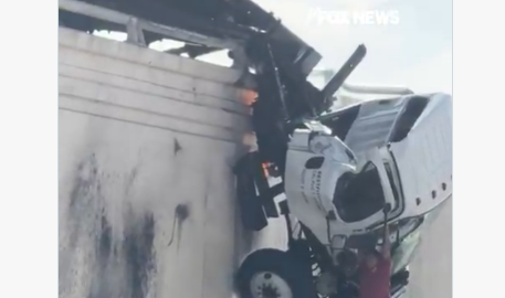 San Diego, California: Bystanders Rush to Catch Man Jumping From Truck Dangling Over I-5 - Video